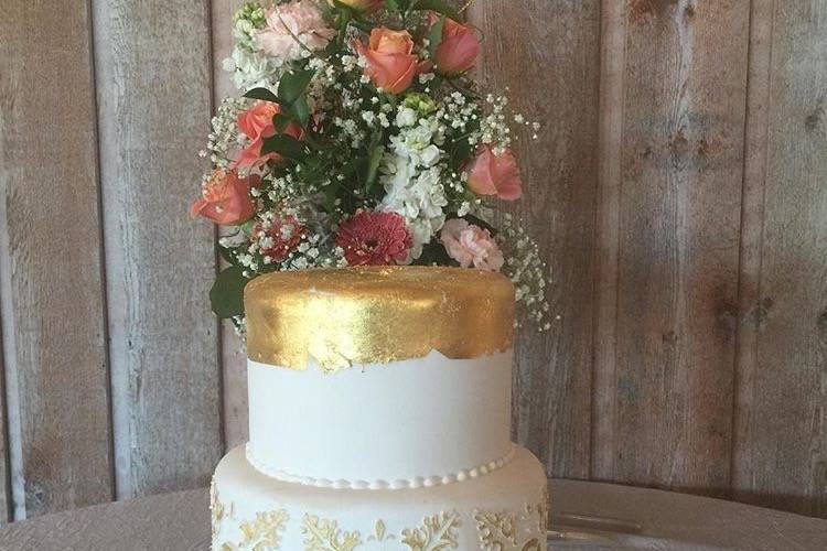 Two tier white and gold cake