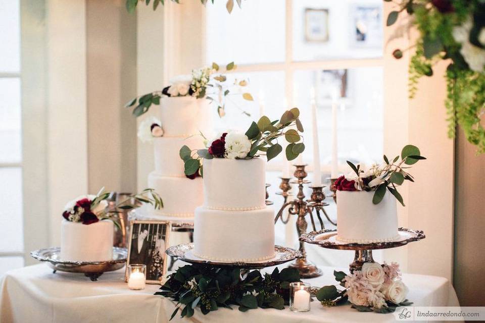 White cake with pink flowers