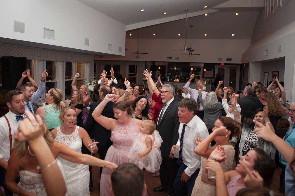 Newlyweds and their guests on the dance floor