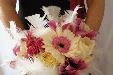 LOVE FEATHERS!  This bouquet has white feathers, Shimmer standard gerbera daisies, pink flash spray roses, Polar Star roses, and Rialto pink lily blossoms.