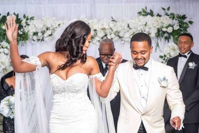 Bride and Groom jump the broom