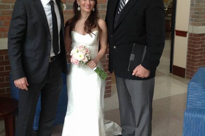 Newlyweds with the officiant