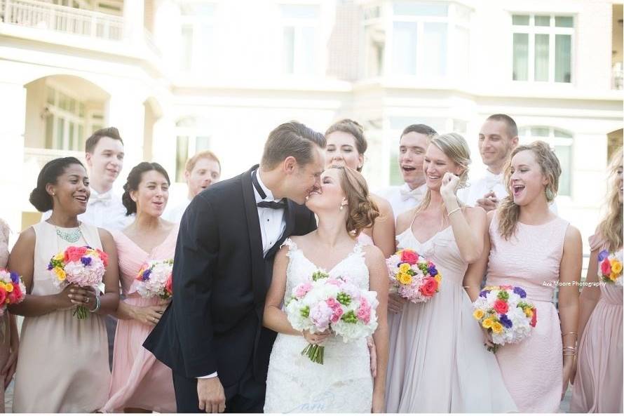 The couple with the bridesmaids and groomsmen