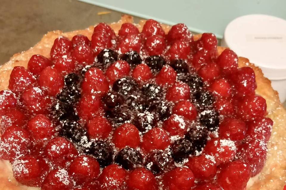 A tart with berries on top