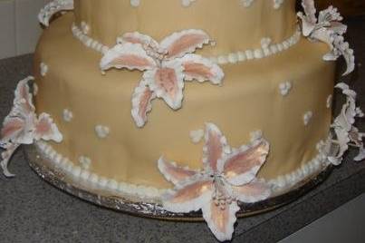 Covered in fondant and gumpaste stargazer lilies