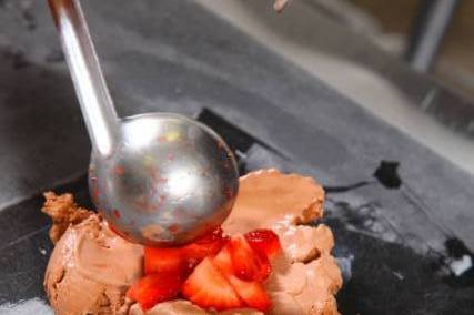 Chocolate Ice Cream with Strawberries and Oreos getting mixed in!