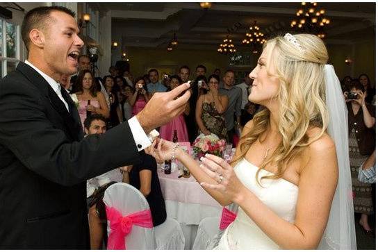 Edge Couple Cutting the Cake at their reception