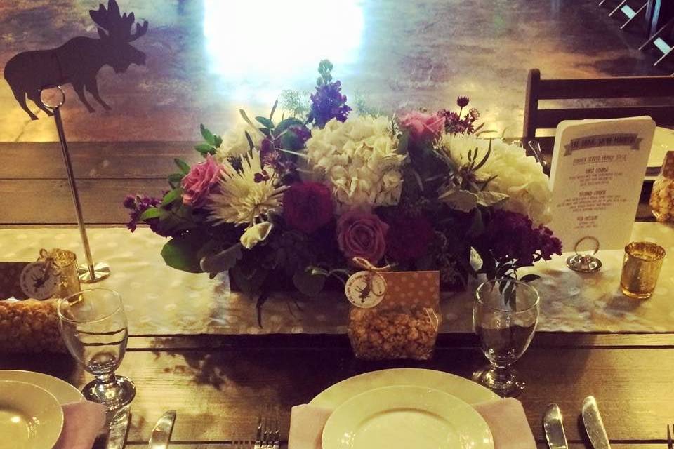 Table setting with flower centerpiece