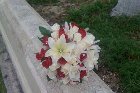 Red and white bouquet. Roses and lilies