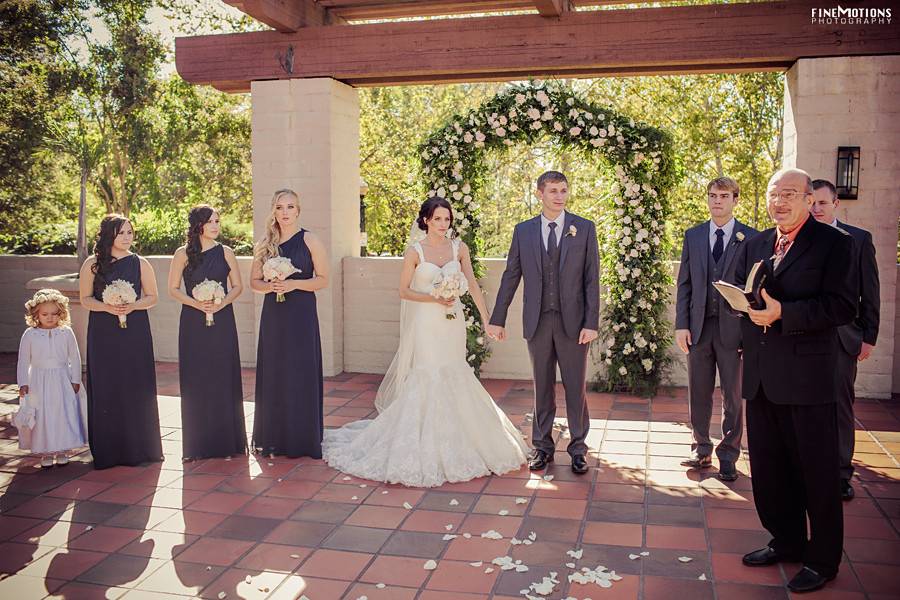 Bride and Groom in front of their beautiful arch