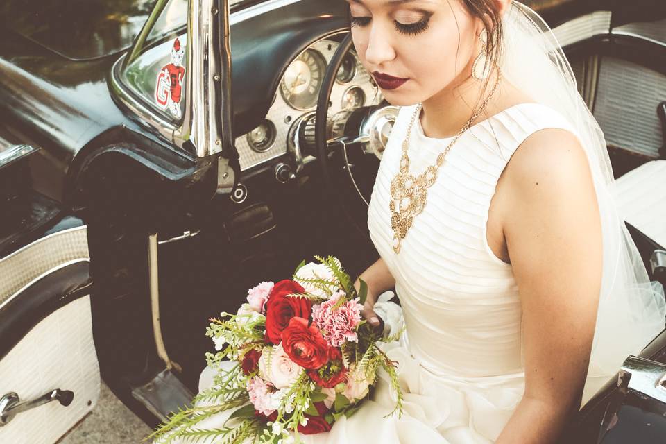 Bride in a vintage car