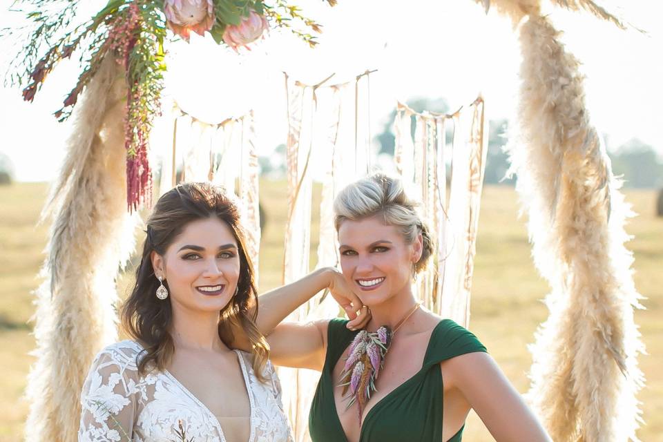 Bride by the wedding arch