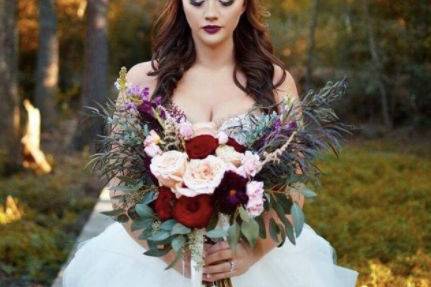 The bride holding bouquet of flowers
