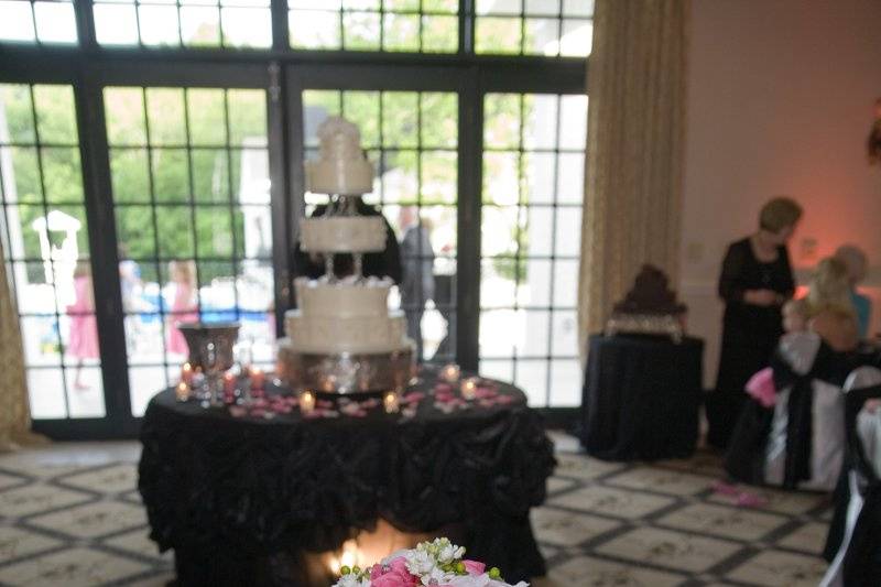 The Sweetheart Table with the Wedding Cake in the Background