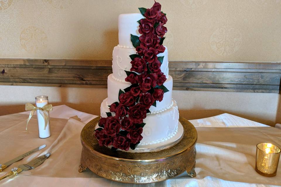 Wedding cake with  dark red roses