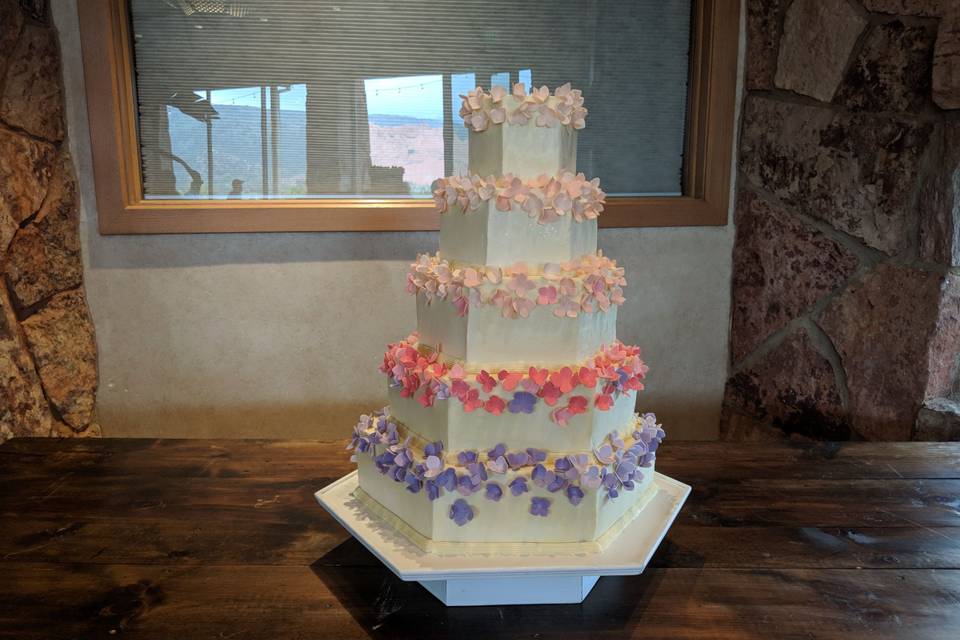 Wedding cake with bits of pastel colors