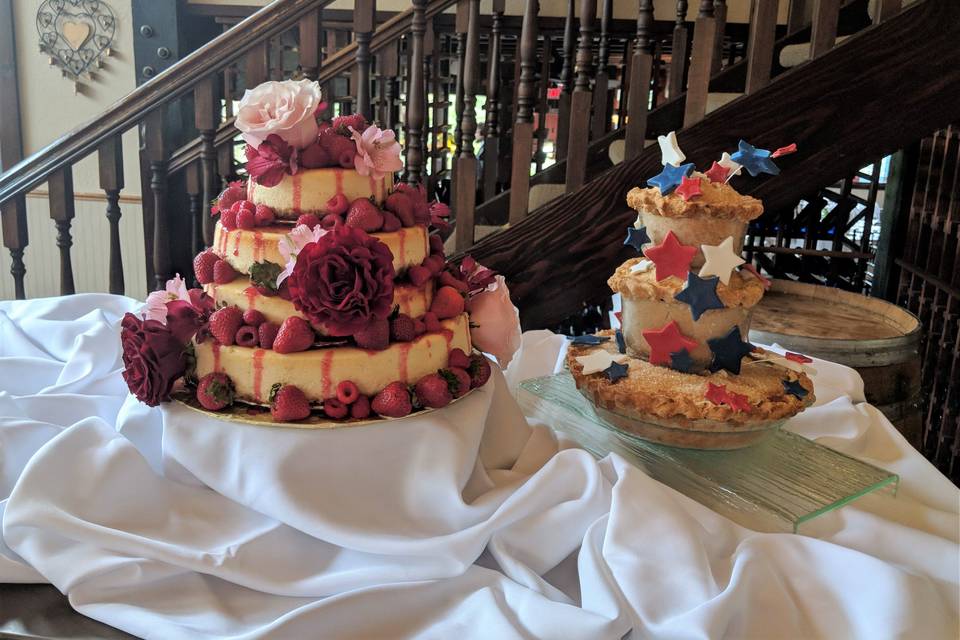 White wedding cake with gold ribbon