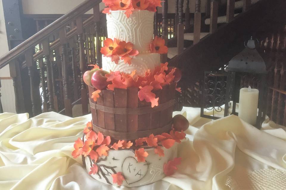 Tall wedding cake with purple flowers