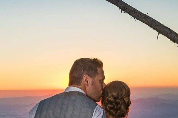 Newlyweds overlooking the sunset