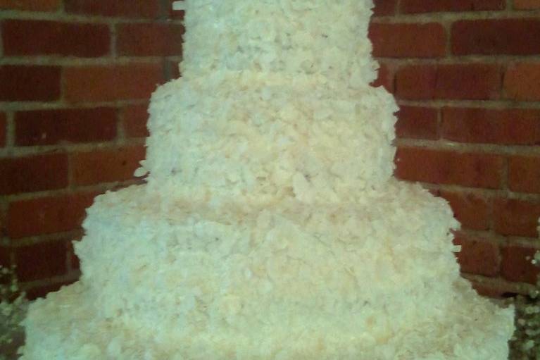 Shredded Coconut covered wedding cake.