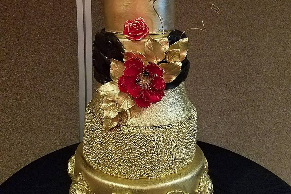 Gold, Black and Red custom designed wedding cake for a New Year's Eve wedding.