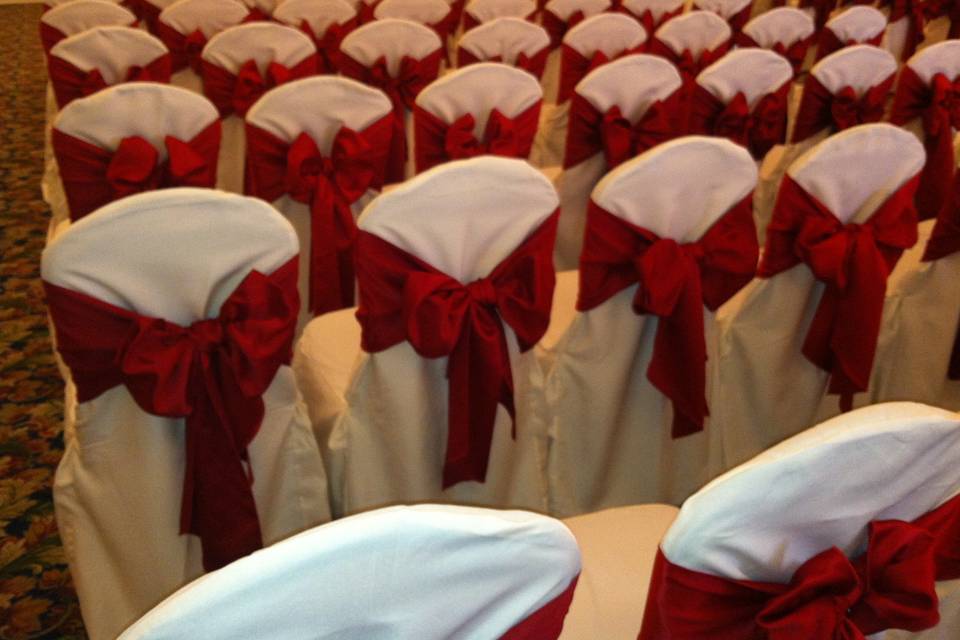 Chairs setup with red bows
