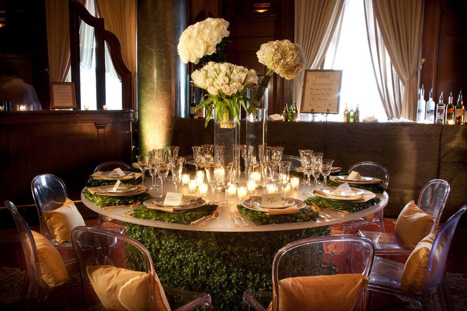 Table setup with candle and floral centerpiece