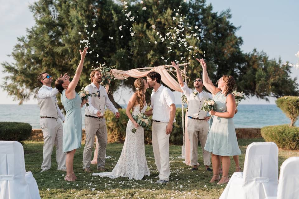 Wedding kiss under the arch