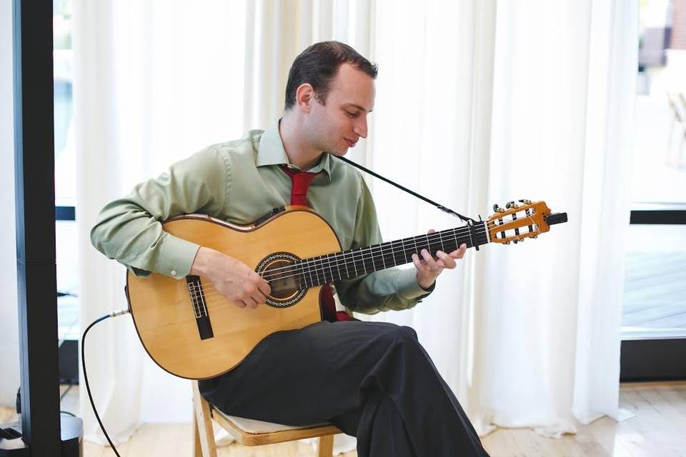 Jim Perona playing his guitar