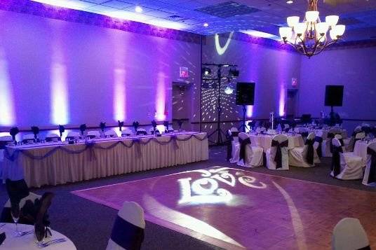 Up-lighting for a wedding reception. This event featured up-lighting, a custom gobo projected on the dance floor and our basic dance lighting package.