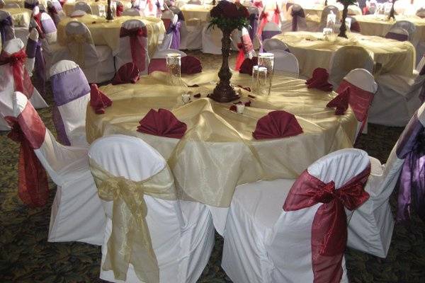 White Chair Covers with Gold, Burgundy, and Plum Organza Sashes