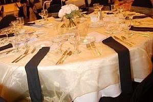 Black Chair Covers with Gold Organza Sashes, Gold Organza Overlays on the tables