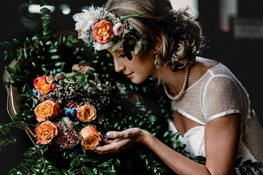 This luxurious flower arrangement  and floral crown will keep guests talking long after this vintage inspired wedding is over. Photo by Jenn Marie Wedding Photography