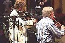 Stephen Holter performing on stage with the Chieftains
