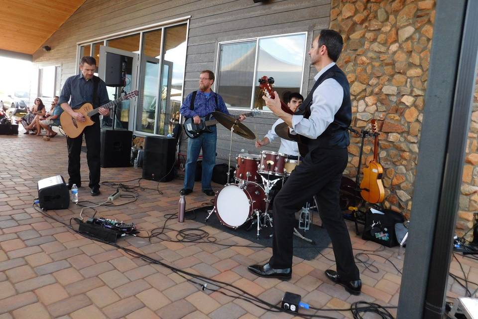 Domingo DeGrazia and His Band performing under our patio cover at a recent party at Flying Leap