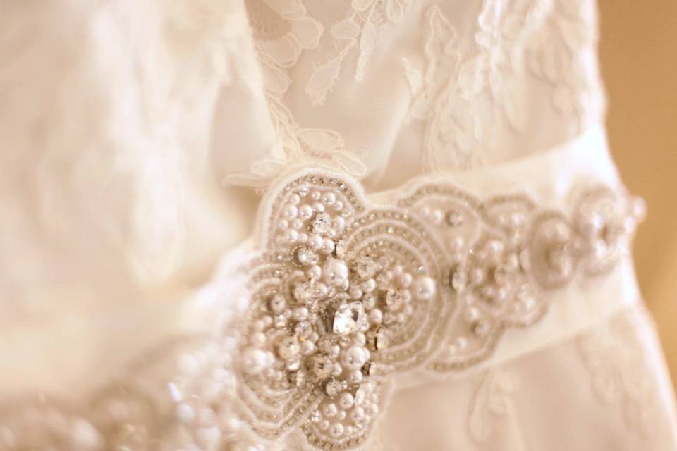 Beautiful tight shot of the beading on Barbara's wedding dress.