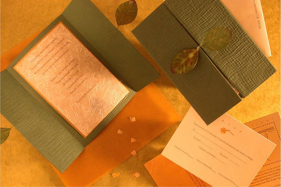 Leaf Wedding: Attached leaves make a perfect closure for this Nature themed design. Featuring specialty paper, pressed flowers and letterpress printing. Appeared on CBS This Morning.