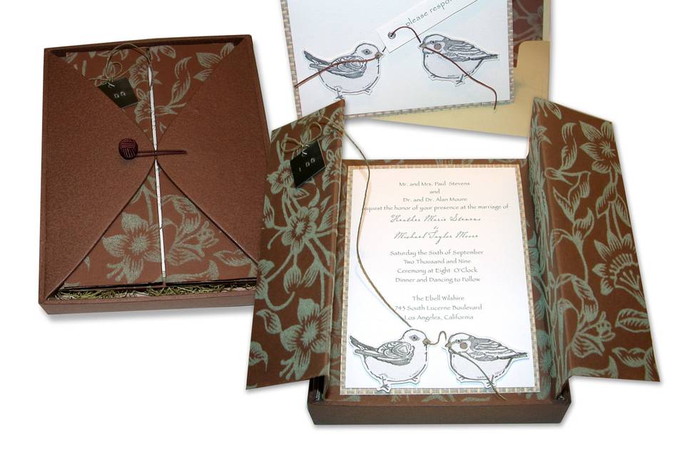 Love Birds: Custom-made paper-covered boxes with flaps and woven-button closures serve as the perfect nest for this invitation suite.