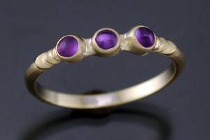 18k gold Stack Rings featuring an assortment of faceted and cabochon gemstones. Priced individually. Call for details!