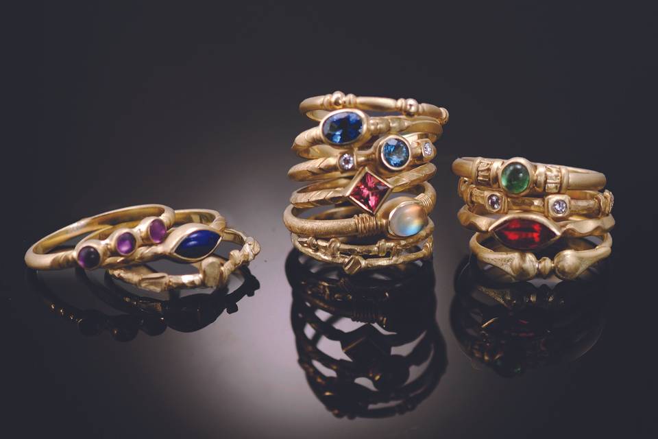 18k gold Stack Rings featuring an assortment of faceted and cabochon gemstones. Priced individually. Call for details!