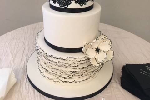 Four tier black and white cake