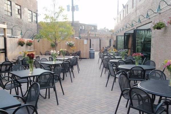 Outdoor patio set for wedding reception.