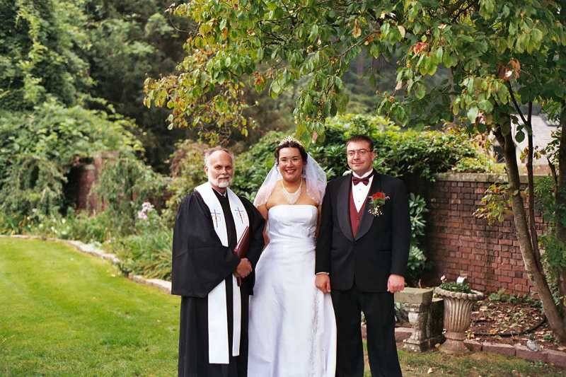 Couple's photo with the officiant