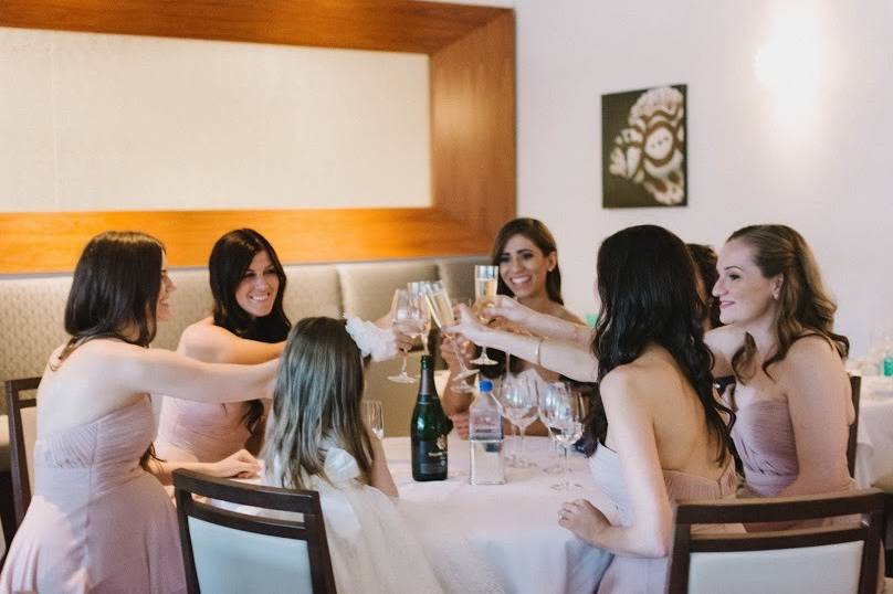 Bride and bridesmaids toasting