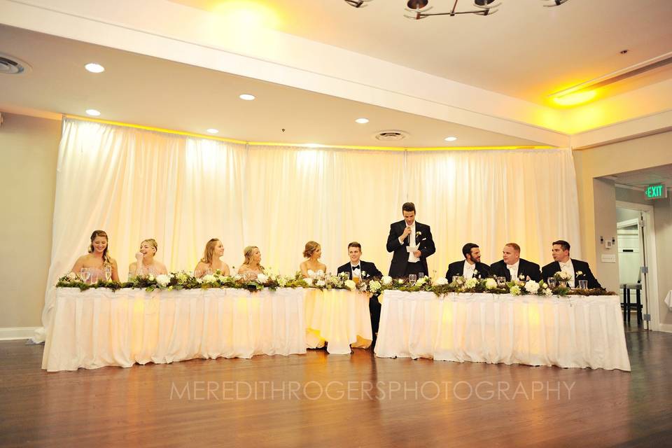 The couple with the bridesmaids and groomsmen