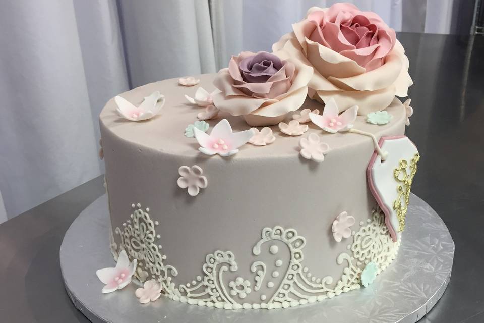 Stunning gray lavender cake with hand piped lace