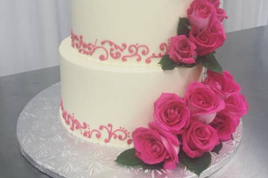 Three-tier cake with rose decorations