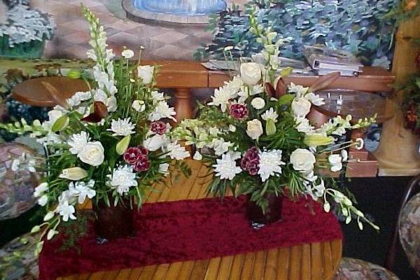 A pair of all whites for the ceremony altar.