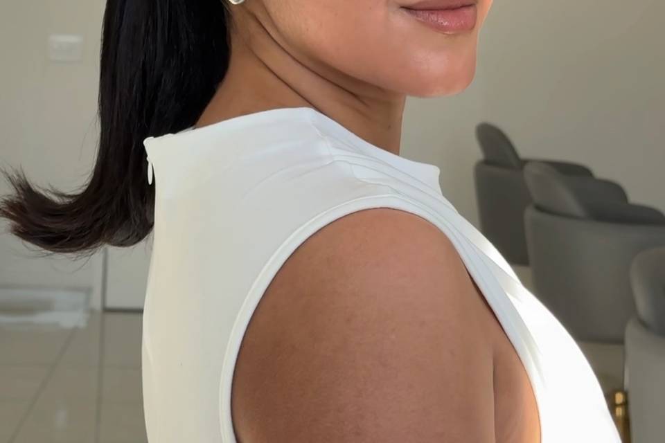 Sleek ponytail and glow makeup