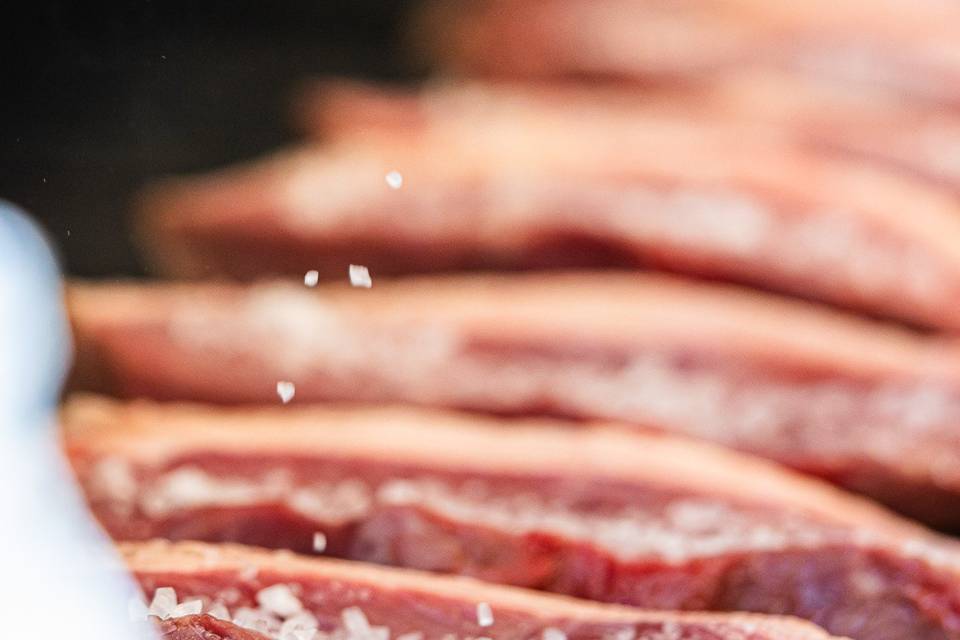 Picanha steak being salted